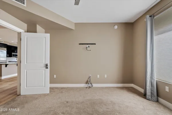 a view of a livingroom with a fireplace a sink and a kitchen counter top
