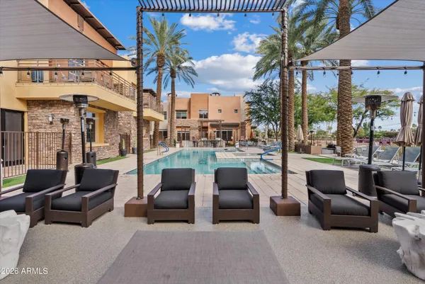 a front view of a building with outdoor seating