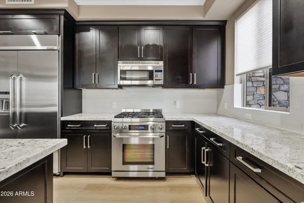 a kitchen with a stove microwave and refrigerator