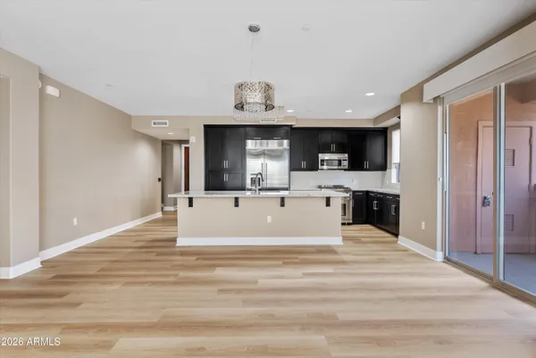 a view of a hallway with a fireplace and a window