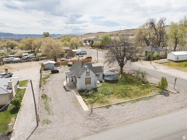 197 West 100 South Redmond, UT 84652 - Photo 31 of 41 Aerial perspective of suburban area featuring a mountainous background