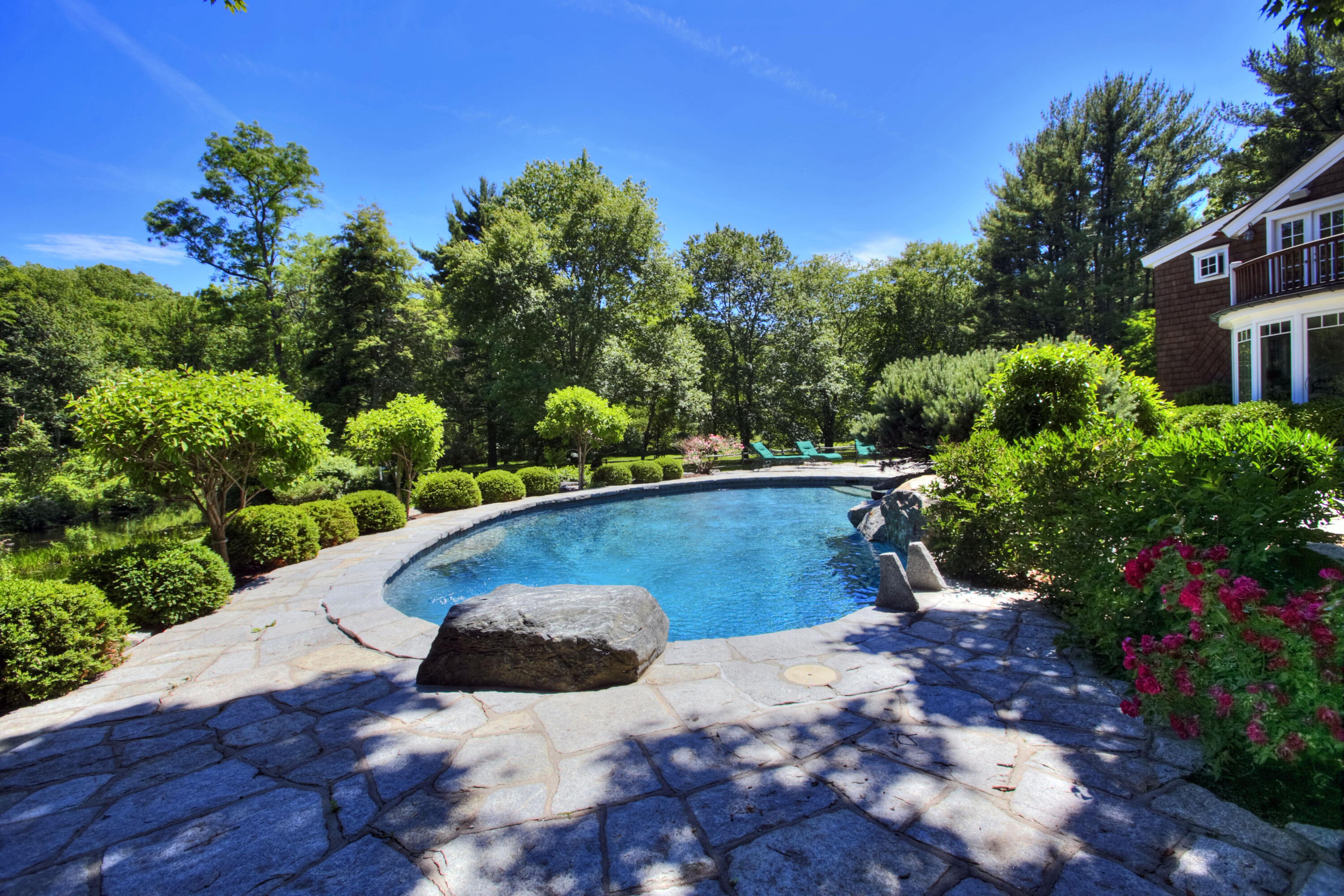 783 Valley Road New Canaan, CT 06840 - Photo 2 of 23 a view of a garden with an outdoor space