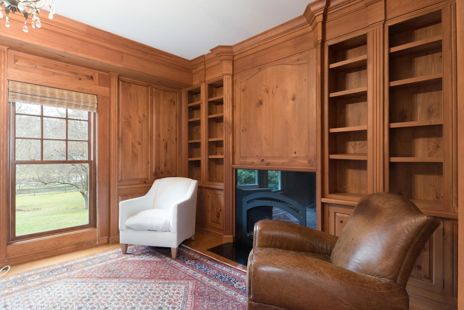 783 Valley Road New Canaan, CT 06840 - Photo 13 of 23 a living room with furniture a window and a fireplace