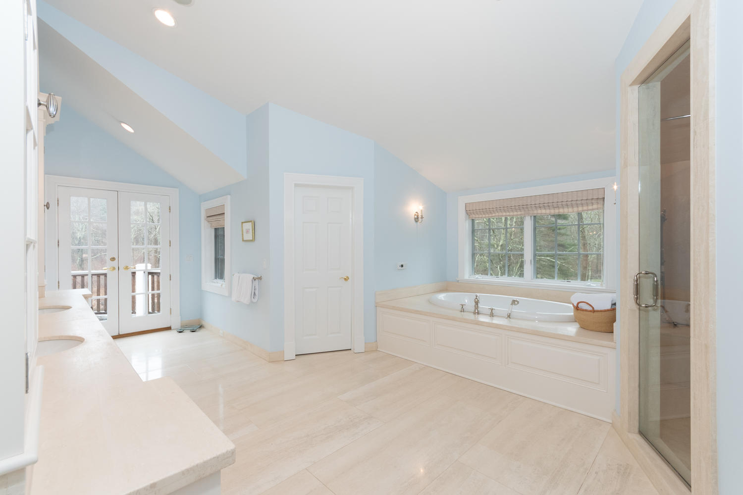 783 Valley Road New Canaan, CT 06840 - Photo 17 of 23 a spacious bedroom with a bed and a large window