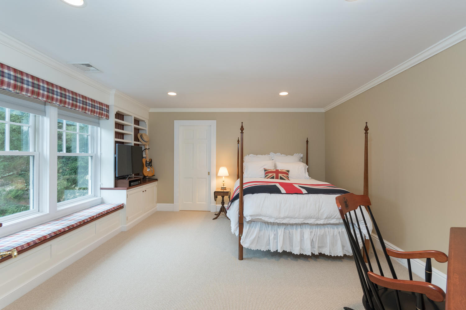 783 Valley Road New Canaan, CT 06840 - Photo 18 of 23 a bedroom with furniture and large windows