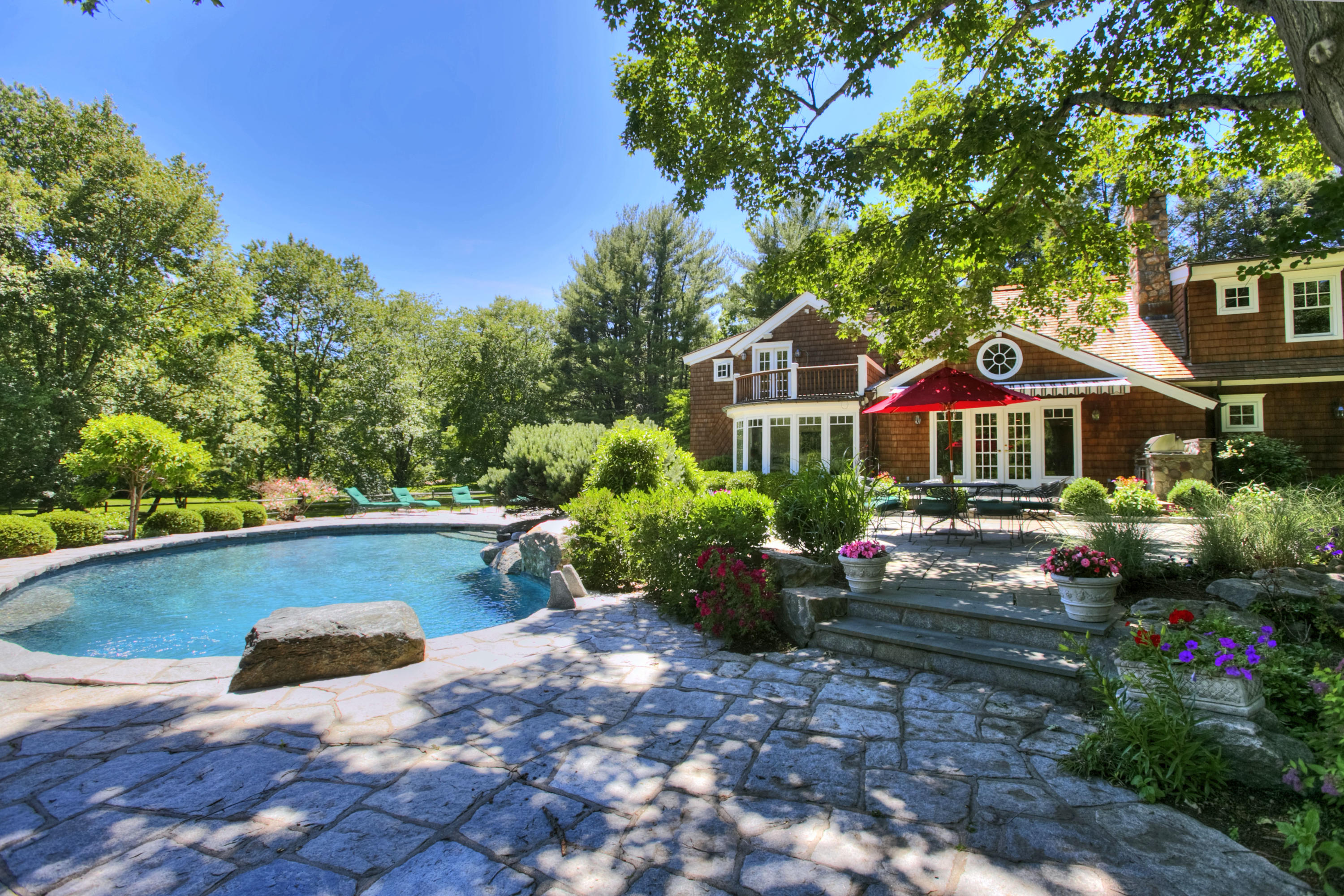 783 Valley Road New Canaan, CT 06840 - Photo 22 of 23 a front view of a house with swimming pool