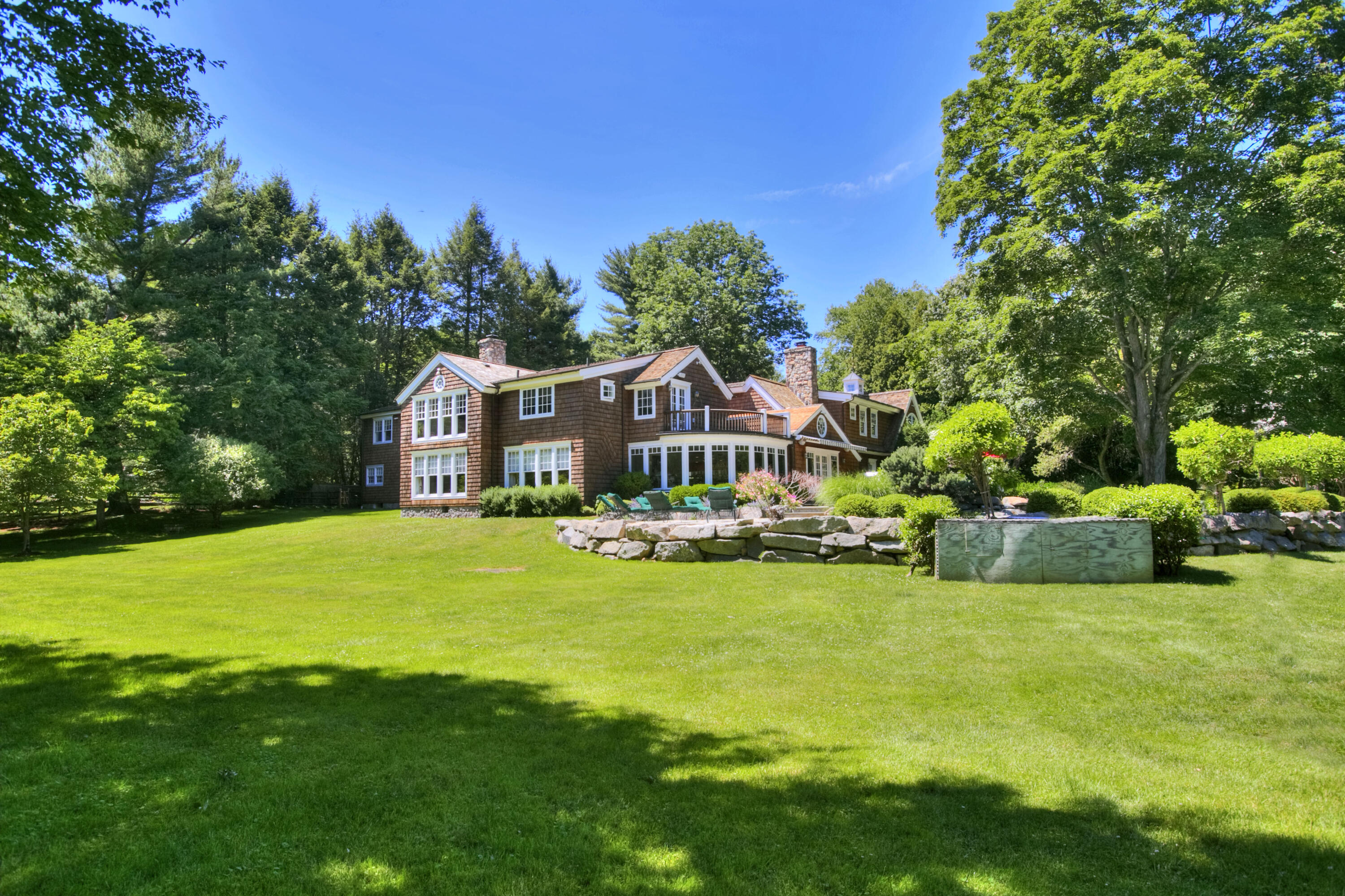 783 Valley Road New Canaan, CT 06840 - Photo 23 of 23 a front view of house with yard and green space