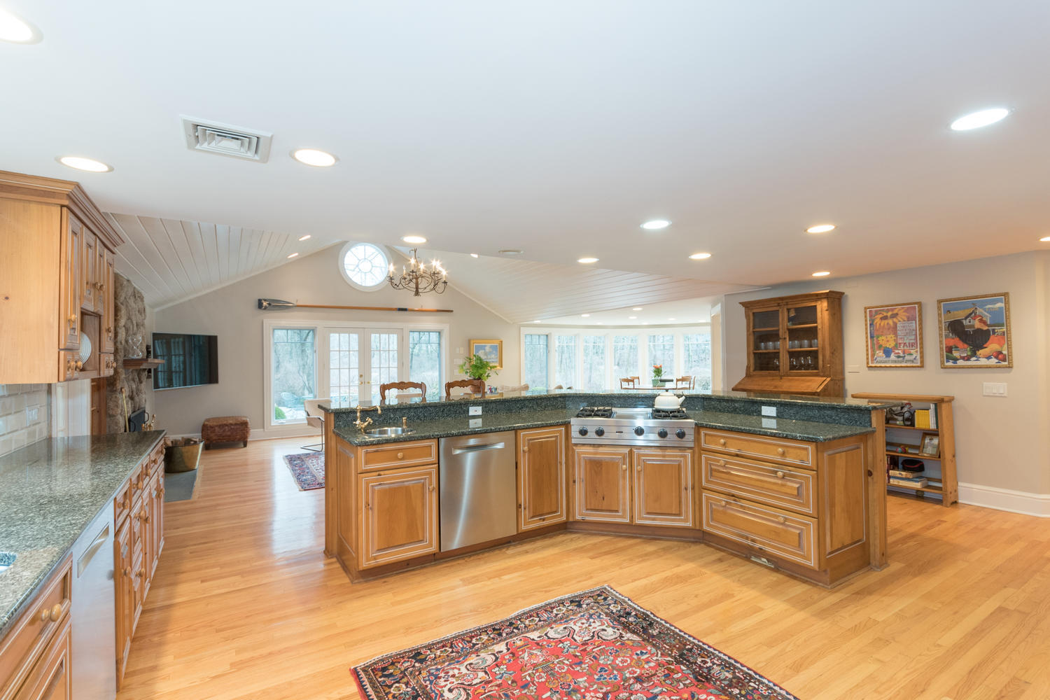 783 Valley Road New Canaan, CT 06840 - Photo 8 of 23 a kitchen with stainless steel appliances granite countertop stove top oven and cabinets