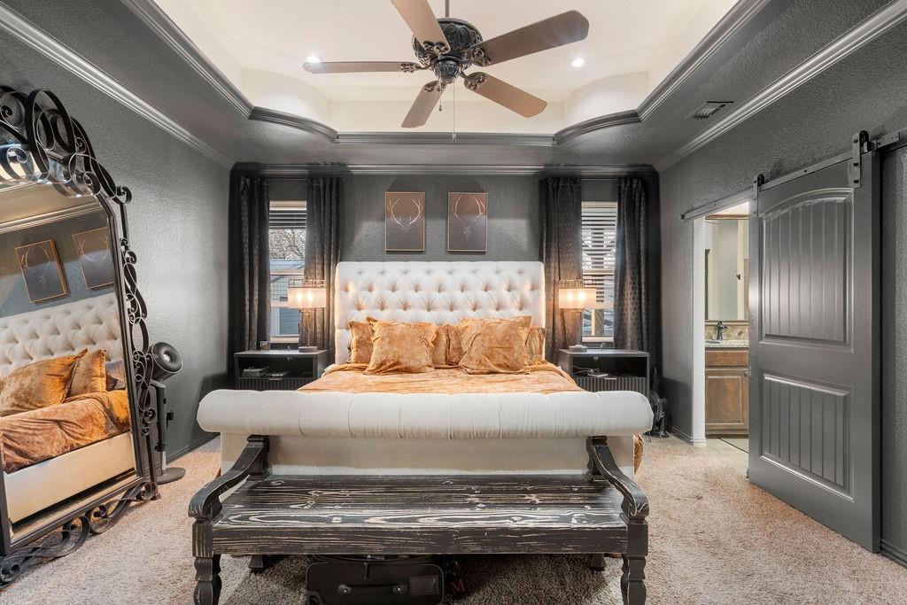 4069 Farm To Market Road 730 North Decatur, TX 76234 - Photo 12 of 33 a bedroom with a bed and a chandelier