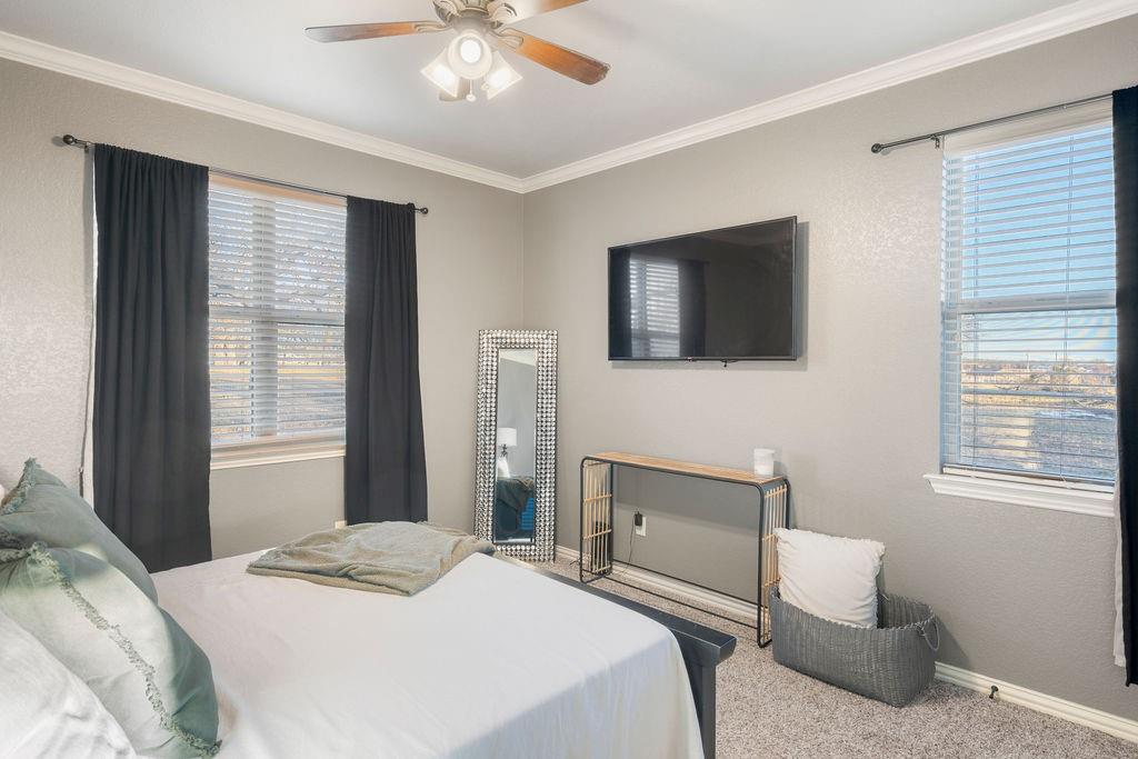 4069 Farm To Market Road 730 North Decatur, TX 76234 - Photo 21 of 33 a bedroom with a bed and a television