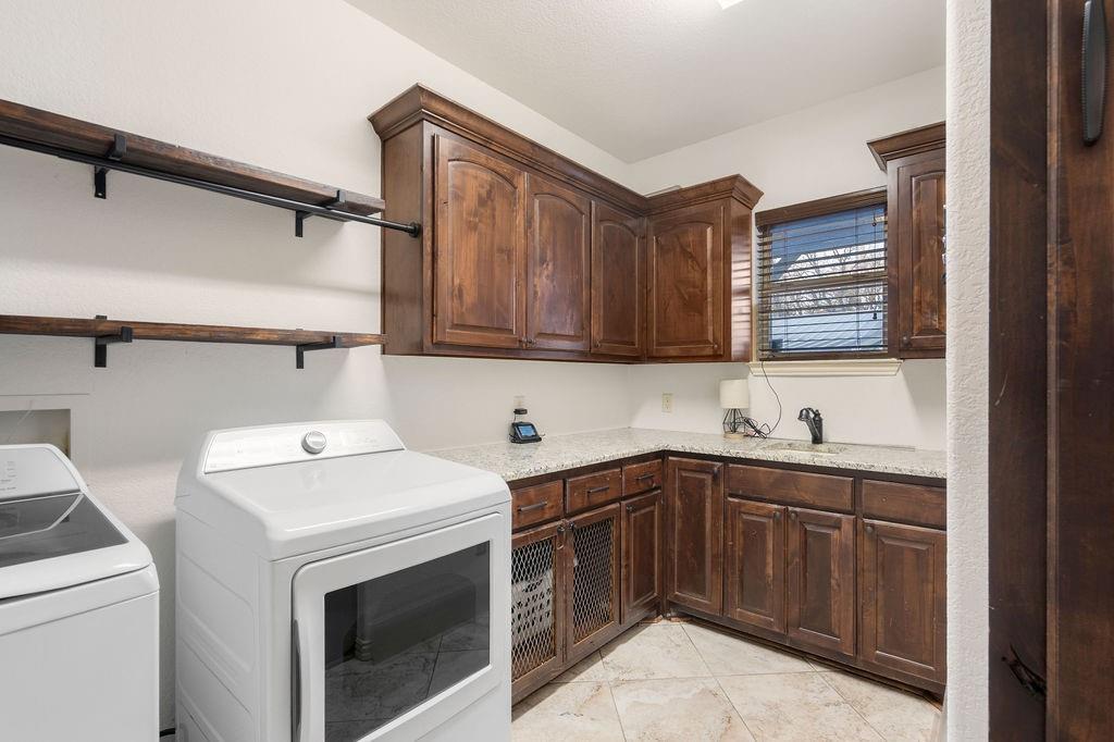 4069 Farm To Market Road 730 North Decatur, TX 76234 - Photo 23 of 33 a utility room with sink dryer and washer