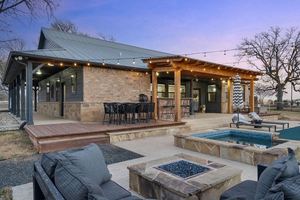 4069 Farm To Market Road 730 North Decatur, TX 76234 - Photo 24 of 33 a view of a patio with table and chairs with wooden floor and plants