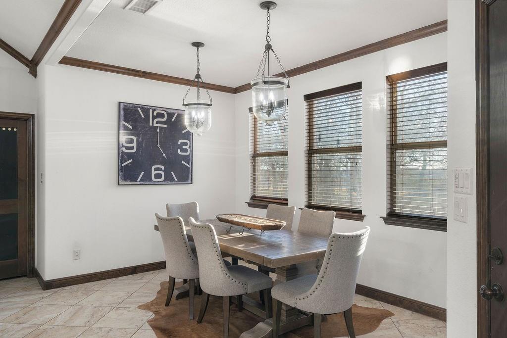 4069 Farm To Market Road 730 North Decatur, TX 76234 - Photo 10 of 33 a view of a dining room with furniture window and wooden floor