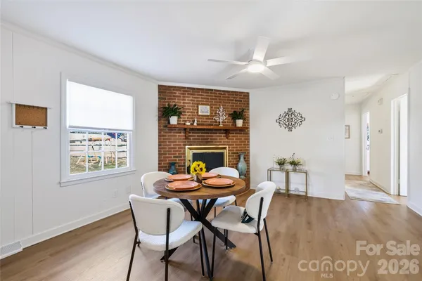 a dining room with furniture and window