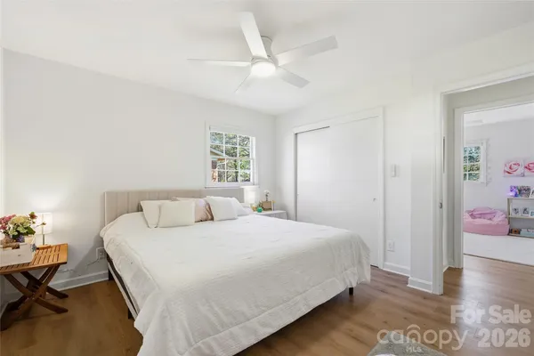 a bedroom with a bed and a table in it