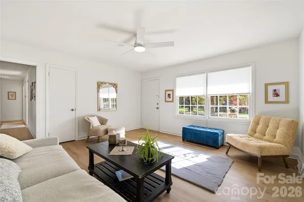 a living room with furniture and a large window