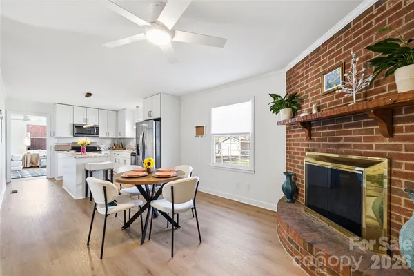 a dining room with furniture and window