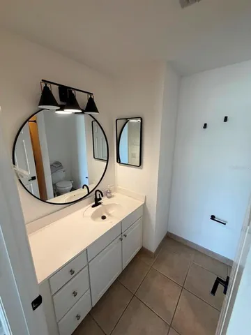 a bathroom with a sink and mirror