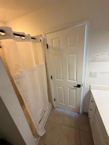 a bathroom with a sink and a shower