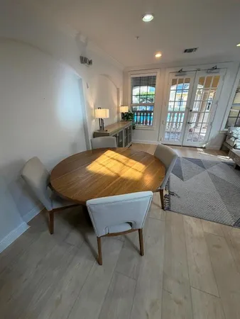 an outdoor space with swimming pool and furniture