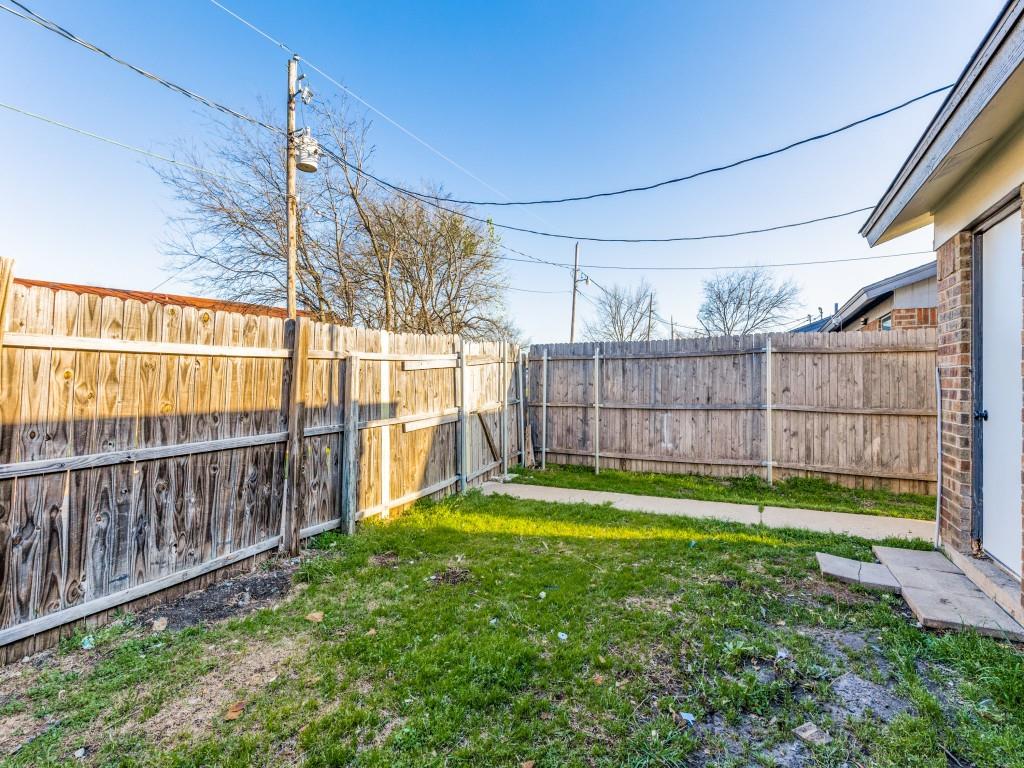 7457 Tiffany Meadows Lane Fort Worth, TX 76140 - Photo 16 of 18 a view of a backyard with a large tree