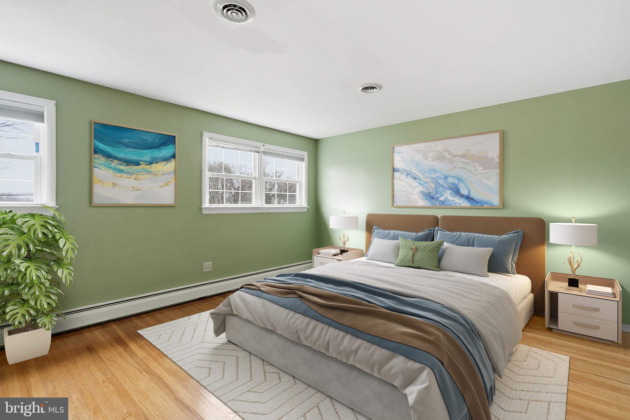 416 Oak Park Road Hatfield, PA 19440 - Photo 26 of 39 a bedroom with a bed and a painting on the wall