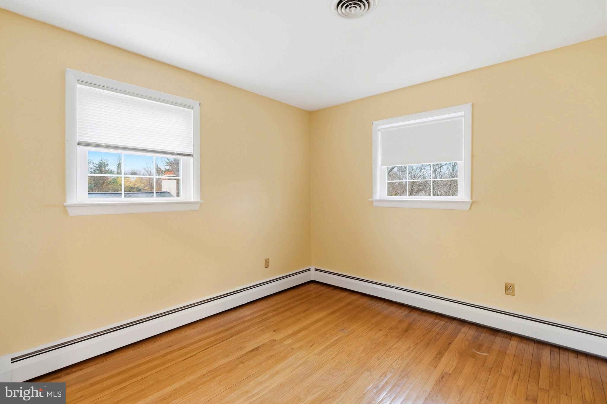 416 Oak Park Road Hatfield, PA 19440 - Photo 30 of 39 a view of an empty room with wooden floor and a window