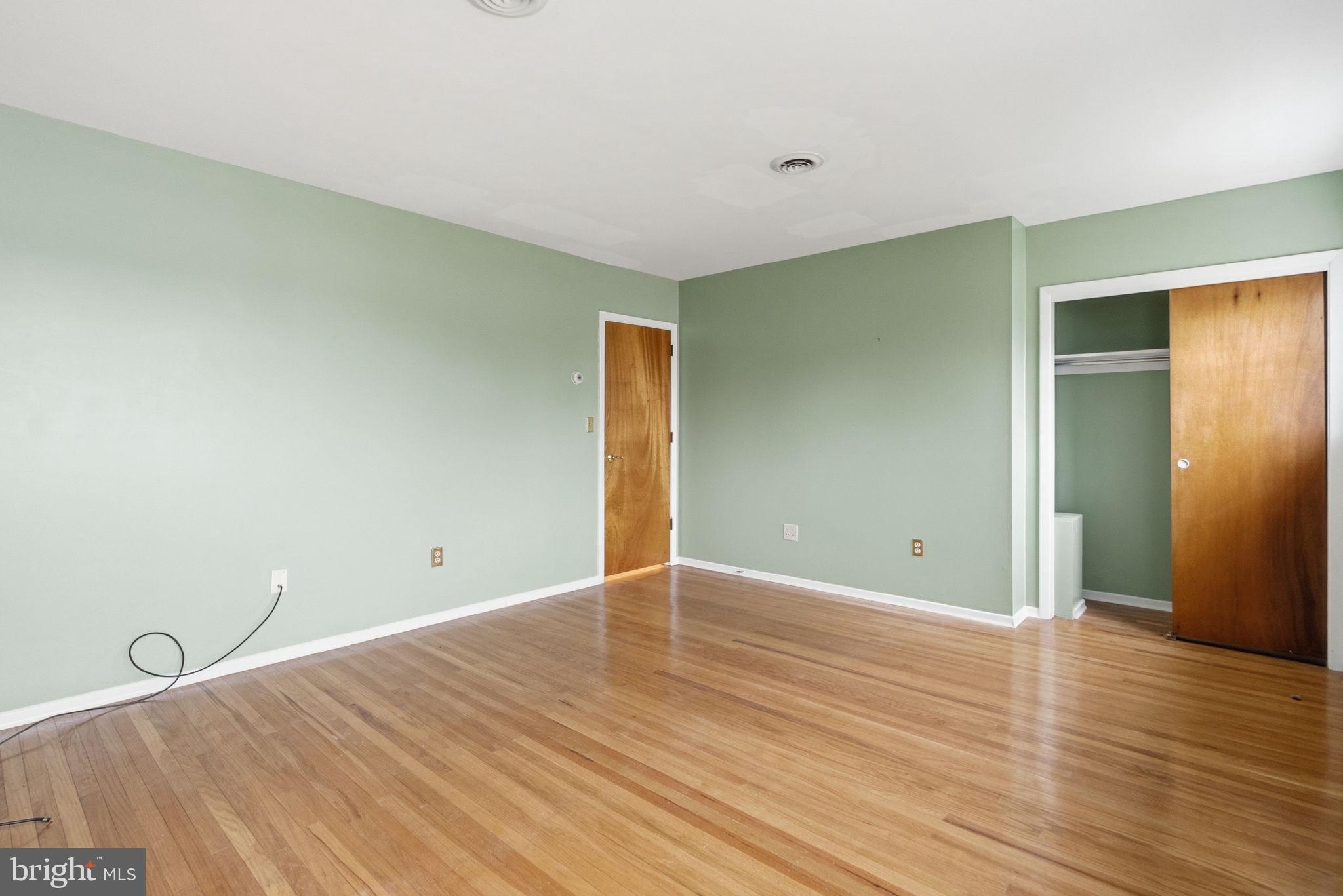 416 Oak Park Road Hatfield, PA 19440 - Photo 31 of 39 a view of an empty room with wooden floor and closet