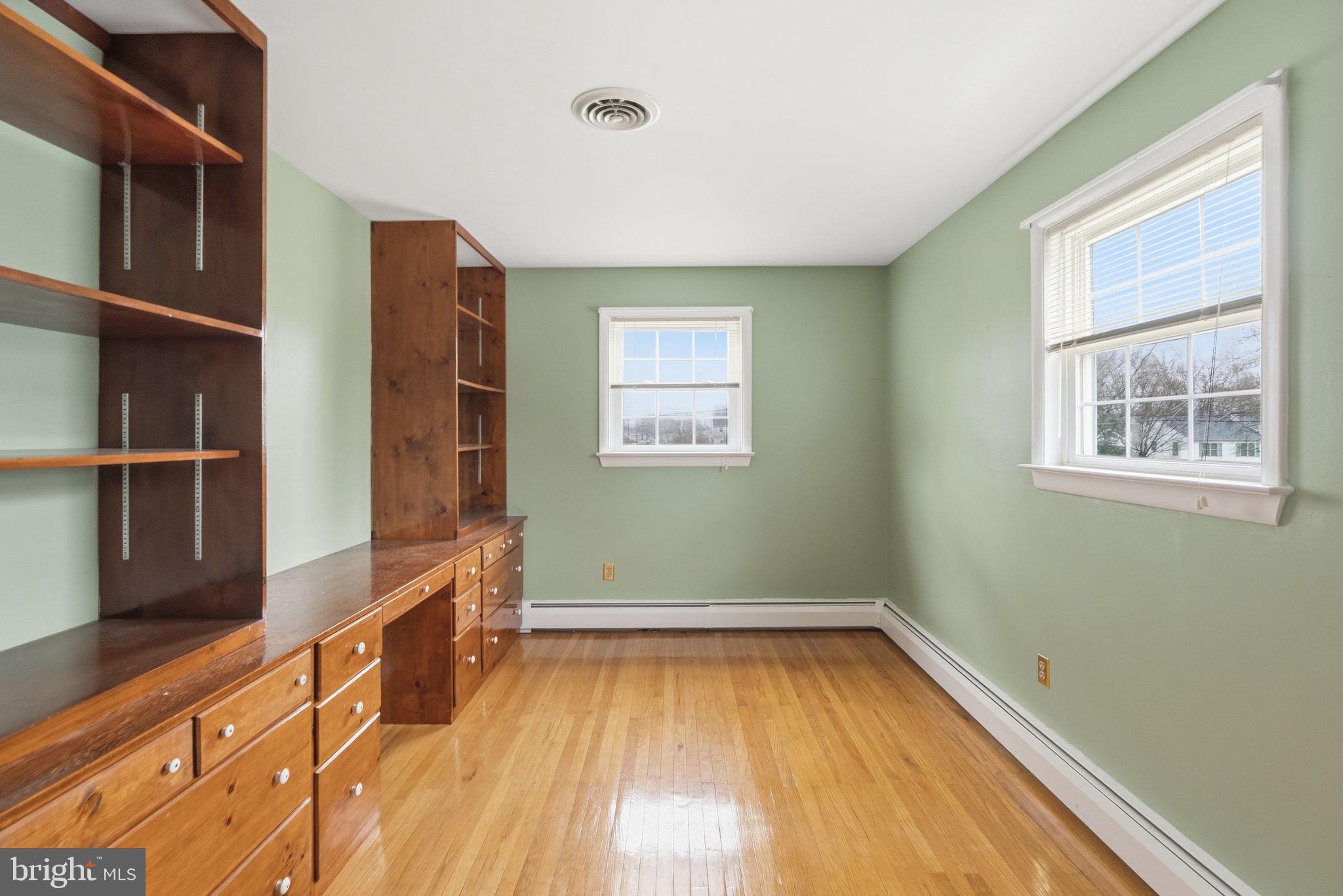 416 Oak Park Road Hatfield, PA 19440 - Photo 32 of 39 a view of empty room with wooden floor and fan