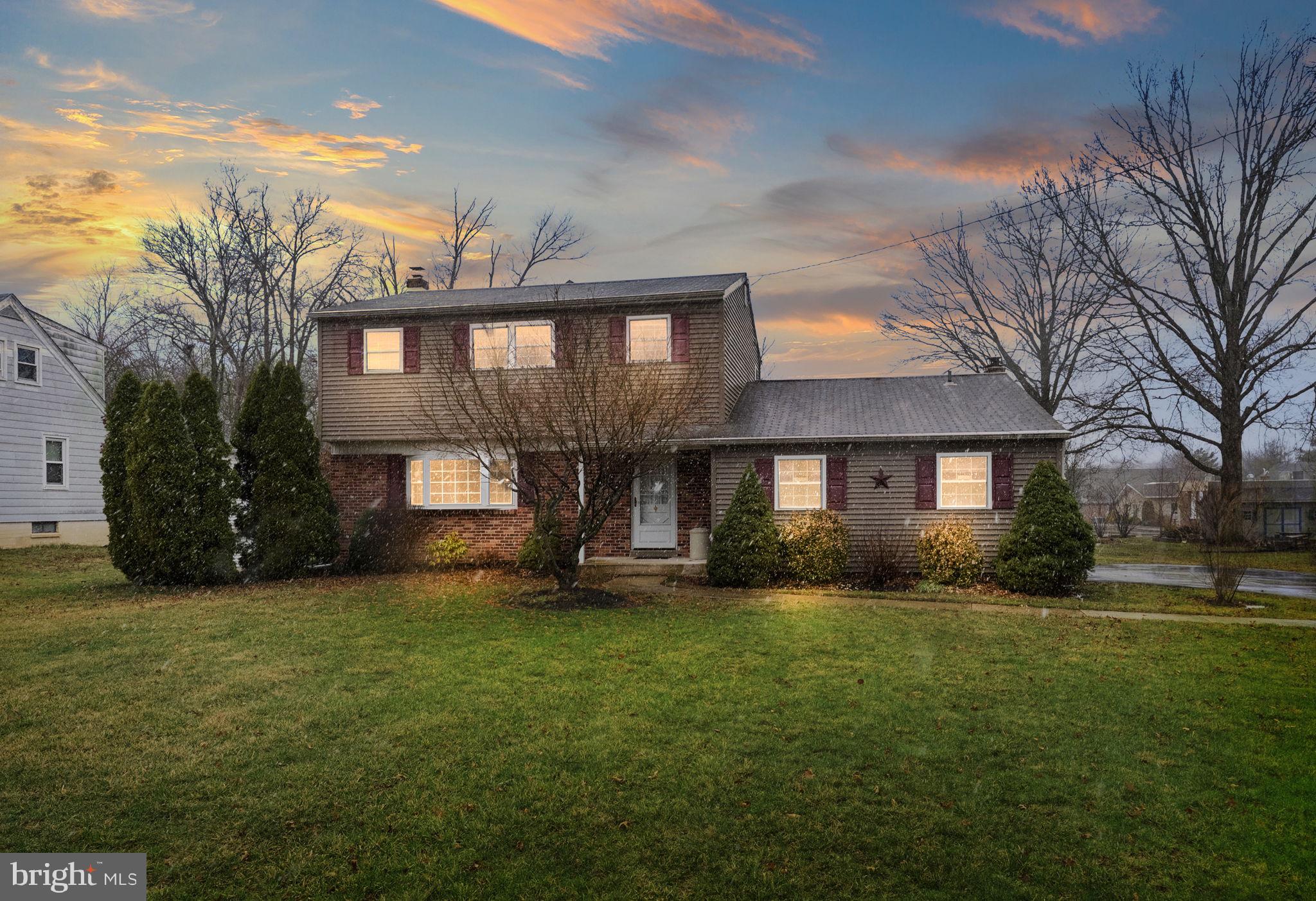 416 Oak Park Road Hatfield, PA 19440 - Photo 4 of 39 a view of a yard in front of a brick house with a yard