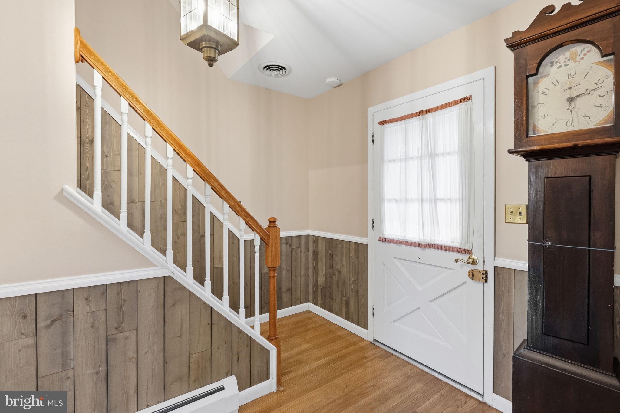 416 Oak Park Road Hatfield, PA 19440 - Photo 6 of 39 a view of staircase with wooden floor and white walls