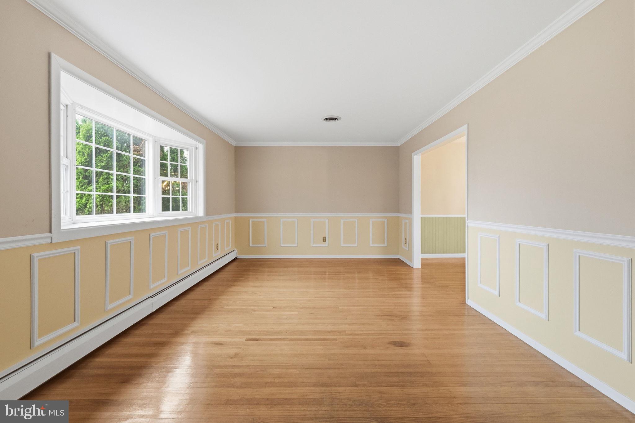 416 Oak Park Road Hatfield, PA 19440 - Photo 9 of 39 an empty room with wooden floor and windows