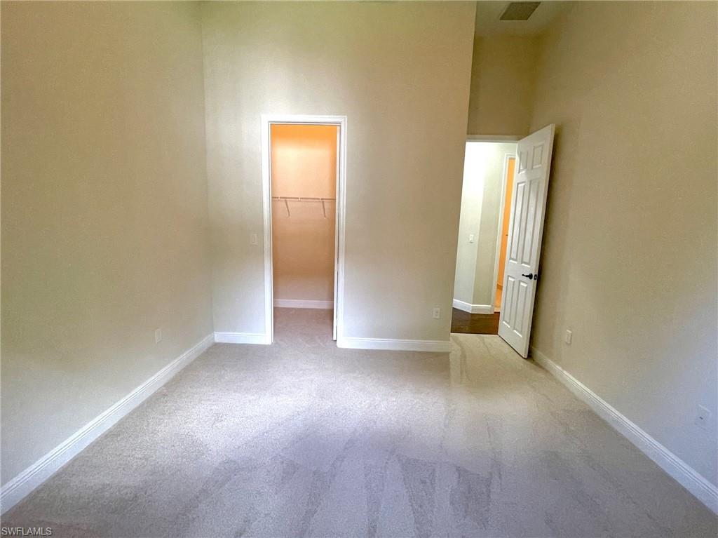 5375 Ferrari Avenue Ave Maria, FL 34142 - Photo 27 of 45 an empty room with windows