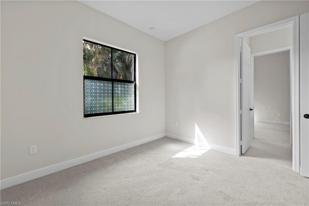 5375 Ferrari Avenue Ave Maria, FL 34142 - Photo 33 of 45 an empty room with windows