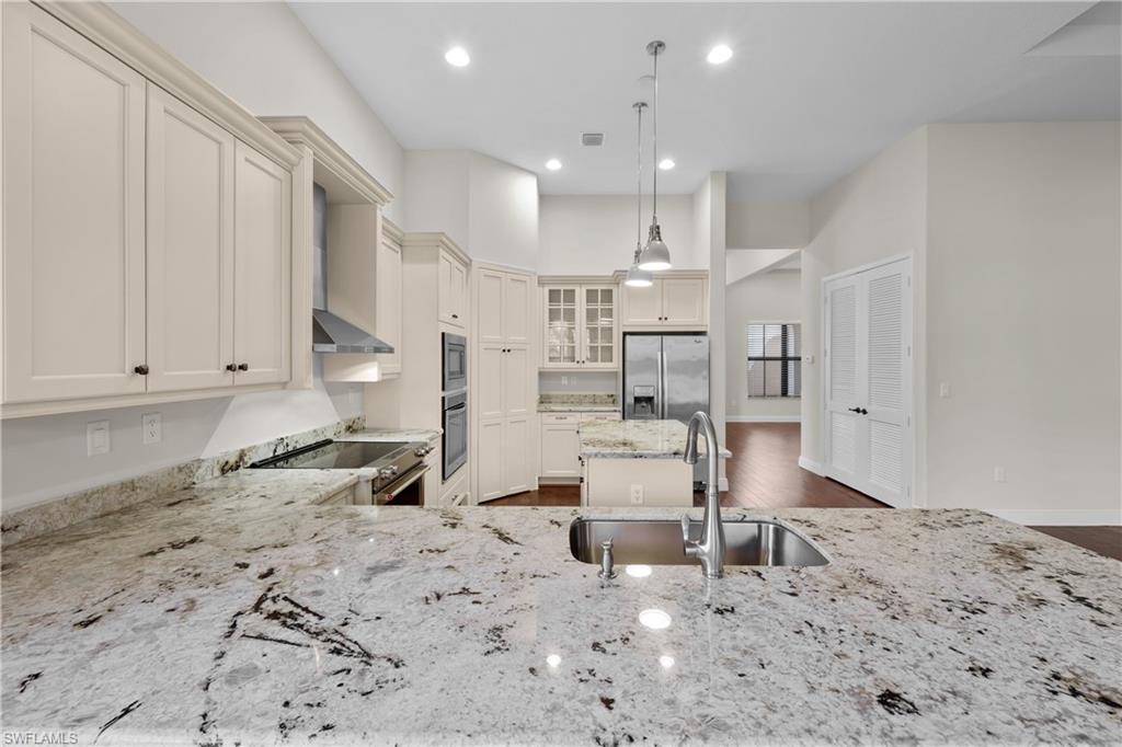 5375 Ferrari Avenue Ave Maria, FL 34142 - Photo 6 of 45 a large kitchen with lots of counter space