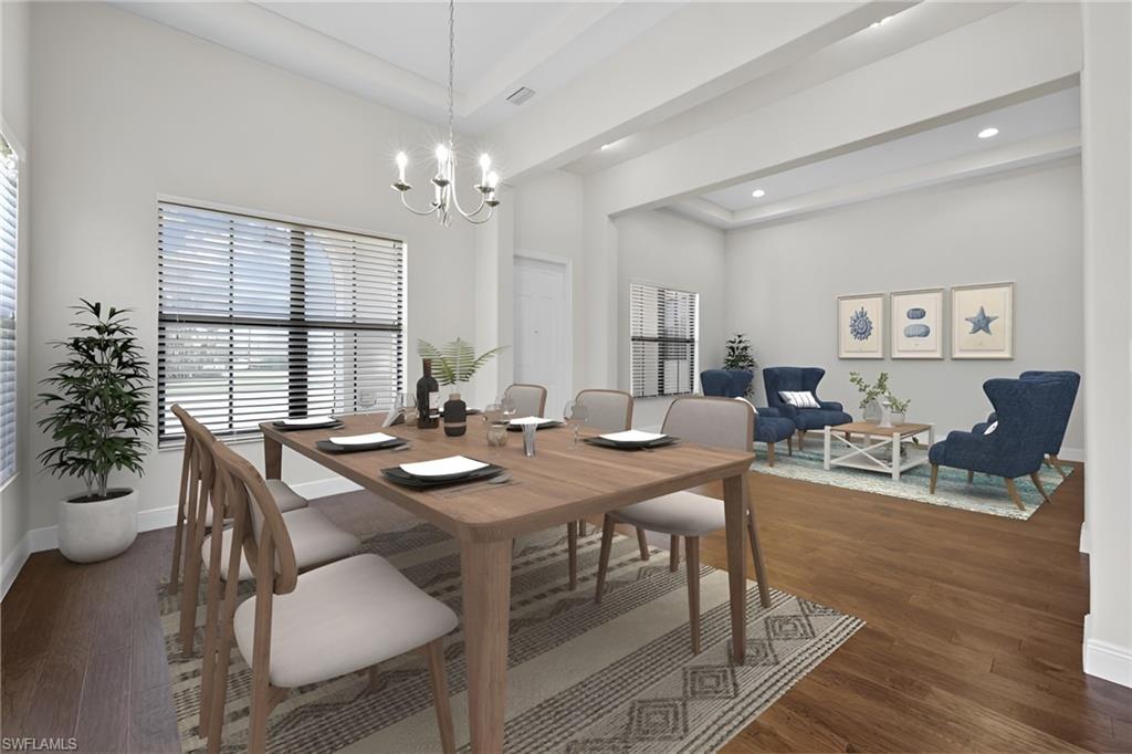 5375 Ferrari Avenue Ave Maria, FL 34142 - Photo 9 of 45 a view of a dining room with furniture window and wooden floor