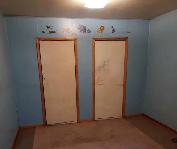 a white toilet sitting next to a window