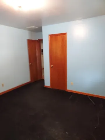 a kitchen with stainless steel appliances granite countertop a sink and a refrigerator