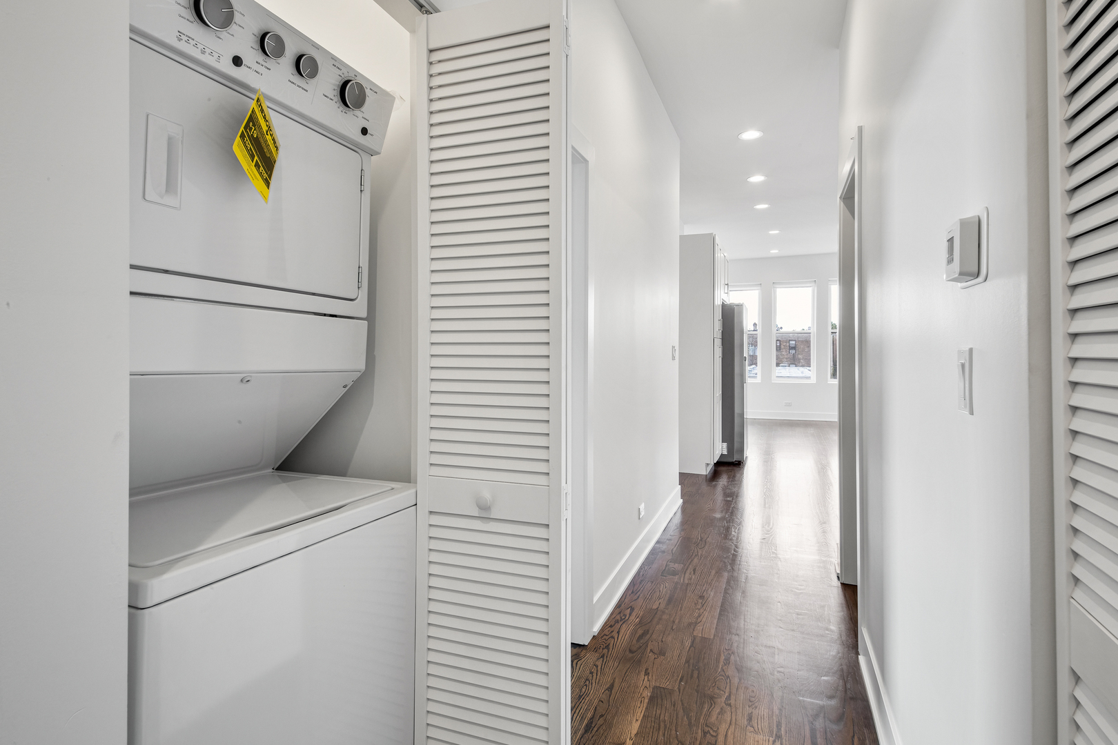 2316 West Augusta Boulevard, Unit 2R Chicago, IL 60622 - Photo 4 of 5 a view of a hallway with washer and dryer