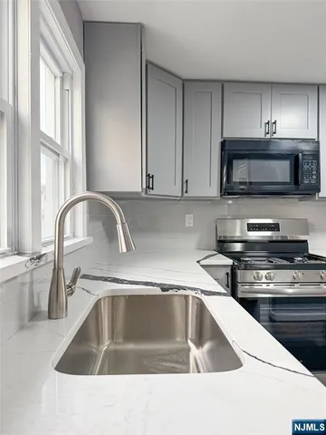 a kitchen with a sink and a microwave