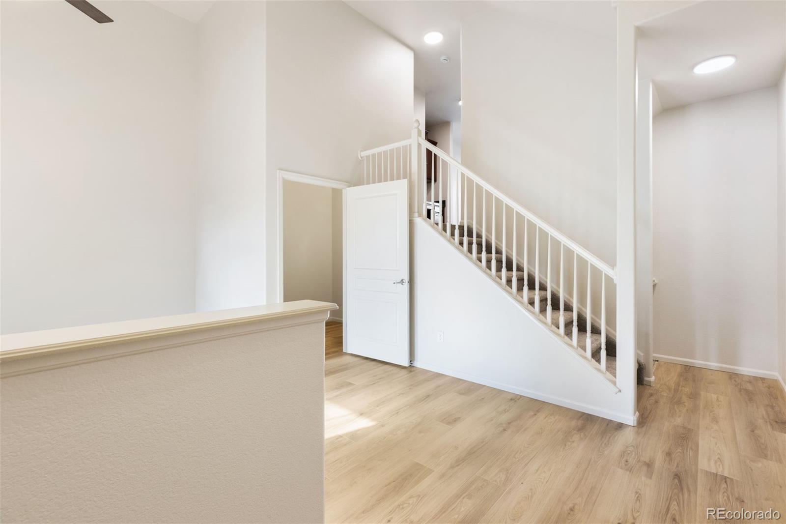 5645 Saint Patrick View Colorado Springs, CO 80923 - Photo 11 of 33 a view of staircase with wooden floor