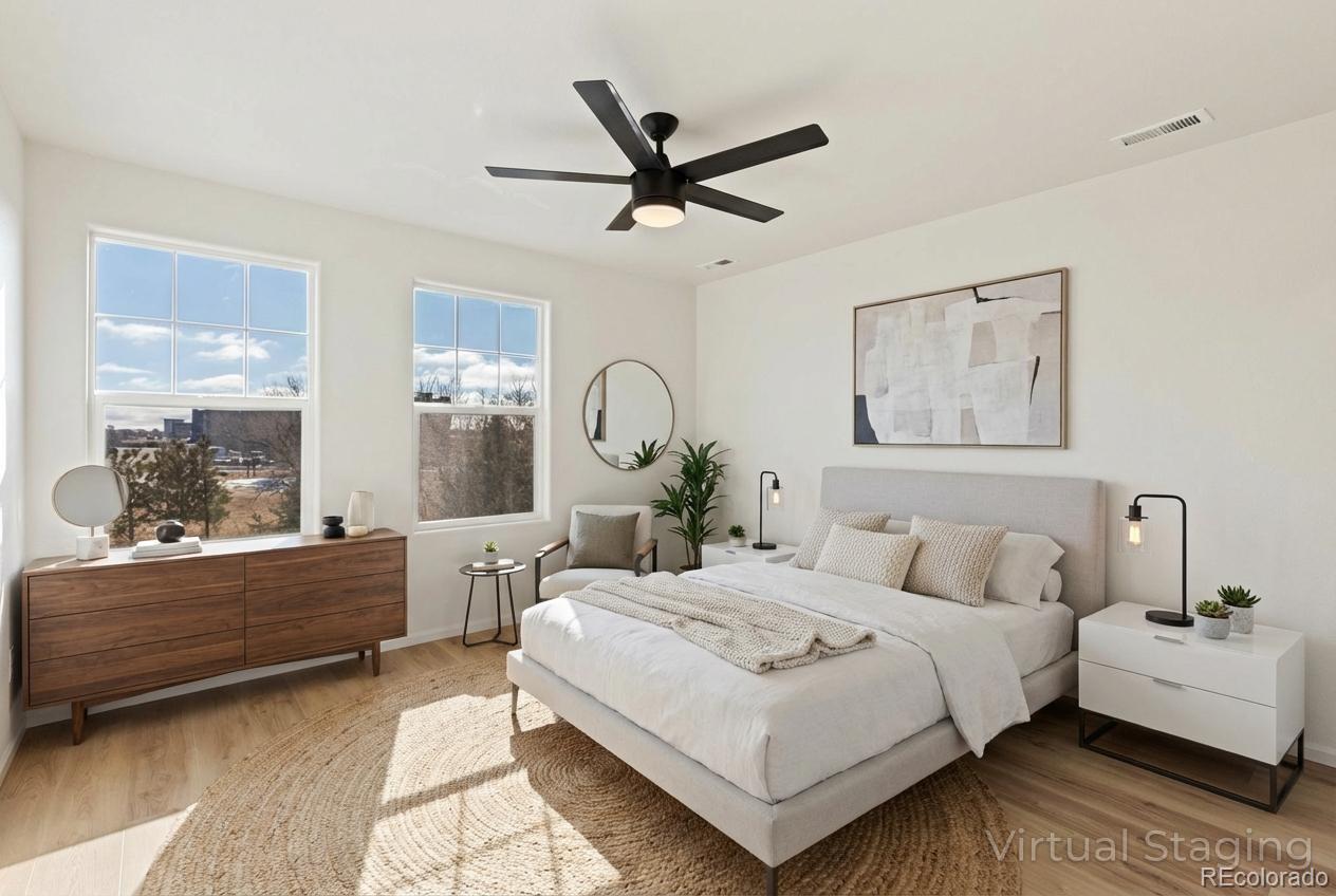 5645 Saint Patrick View Colorado Springs, CO 80923 - Photo 24 of 33 a bedroom with a bed and a dresser