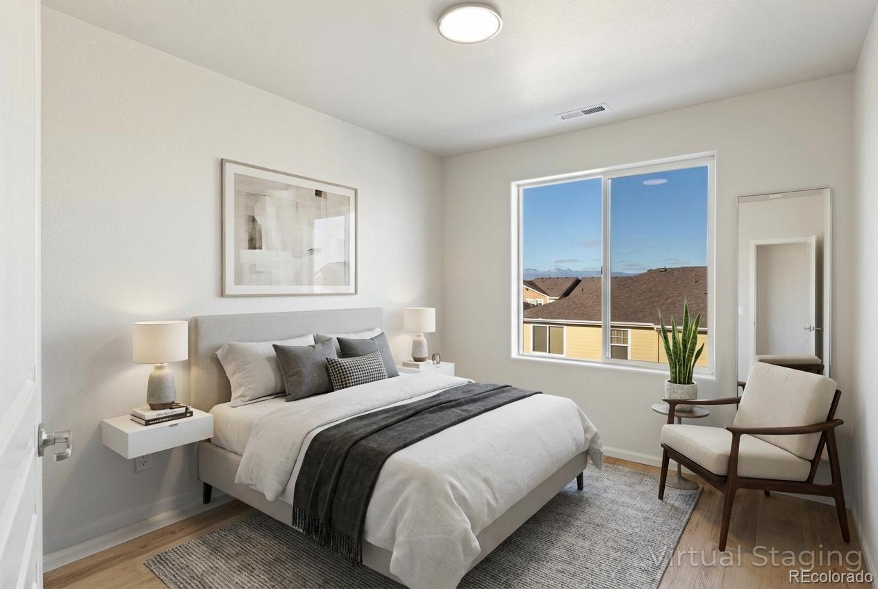 5645 Saint Patrick View Colorado Springs, CO 80923 - Photo 28 of 33 a bedroom with a bed and a window