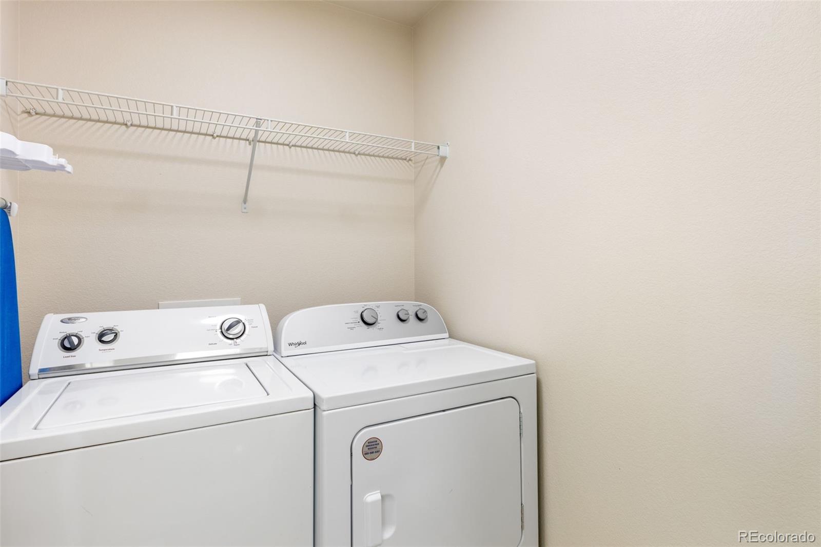5645 Saint Patrick View Colorado Springs, CO 80923 - Photo 32 of 33 a utility room with dryer and washer