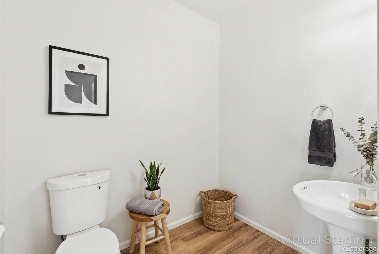 5645 Saint Patrick View Colorado Springs, CO 80923 - Photo 8 of 33 a bathroom with a toilet and a sink
