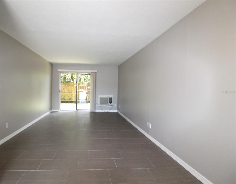 3001 Bee Ridge Road, Unit 111 Sarasota, FL 34239 - Photo 5 of 20 an empty room with windows