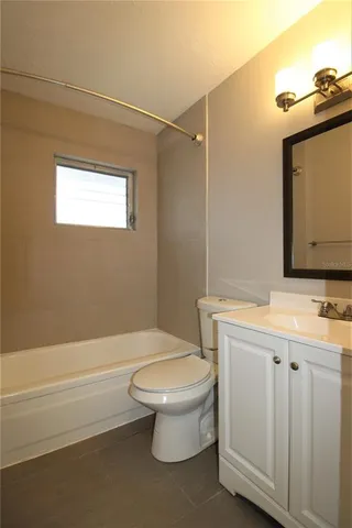 a bathroom with a toilet a sink and bathtub