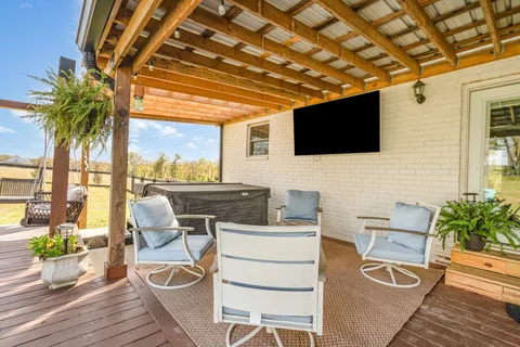 a work room with furniture and flat screen tv