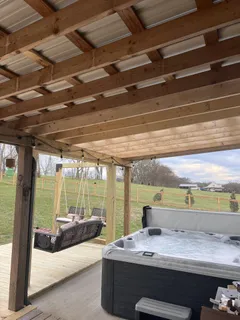 a room with a bed and large window