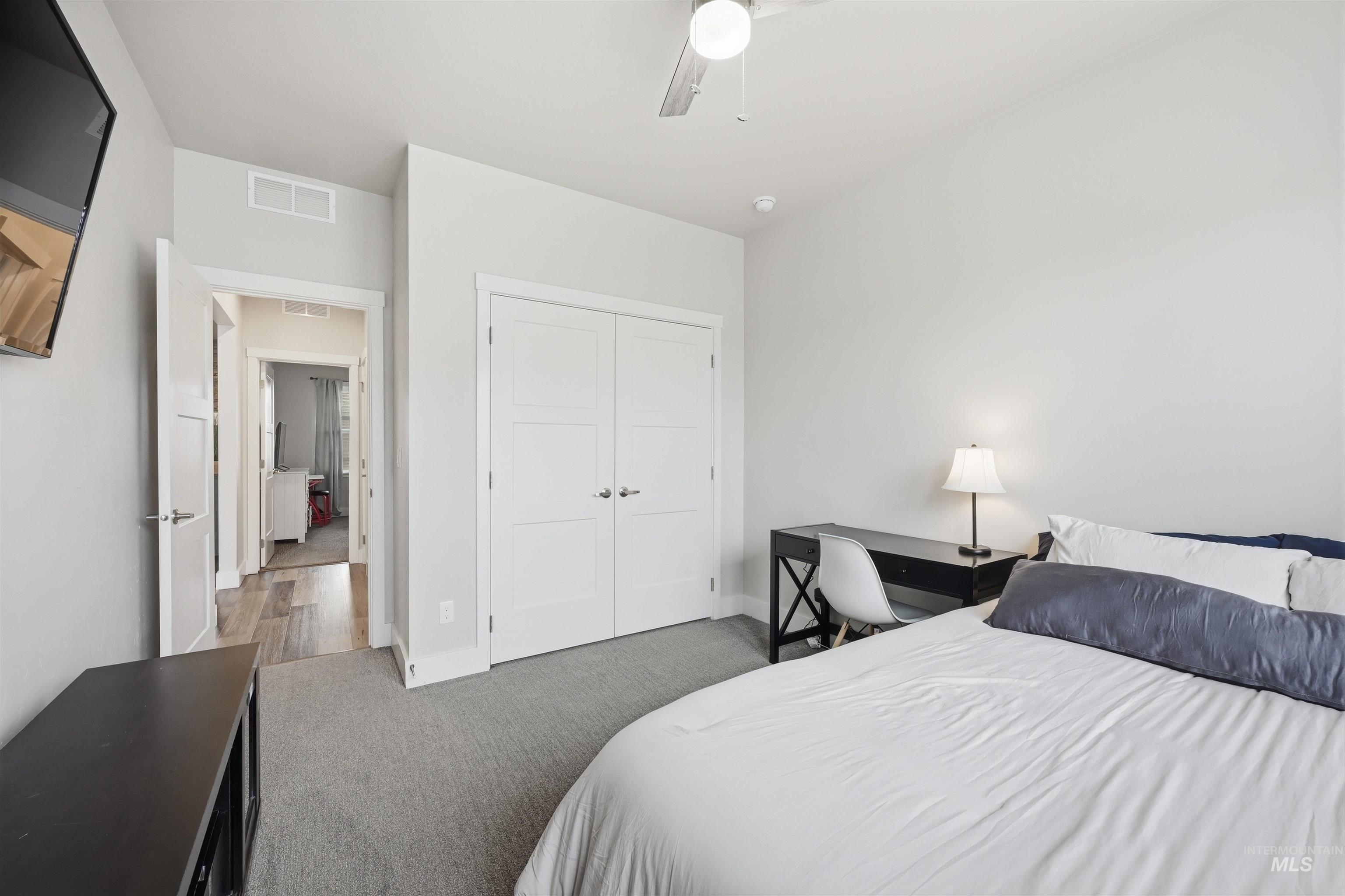 2229 East Grayson Street Meridian, ID 83642 - Photo 33 of 40 Carpeted bedroom with a closet and ceiling fan